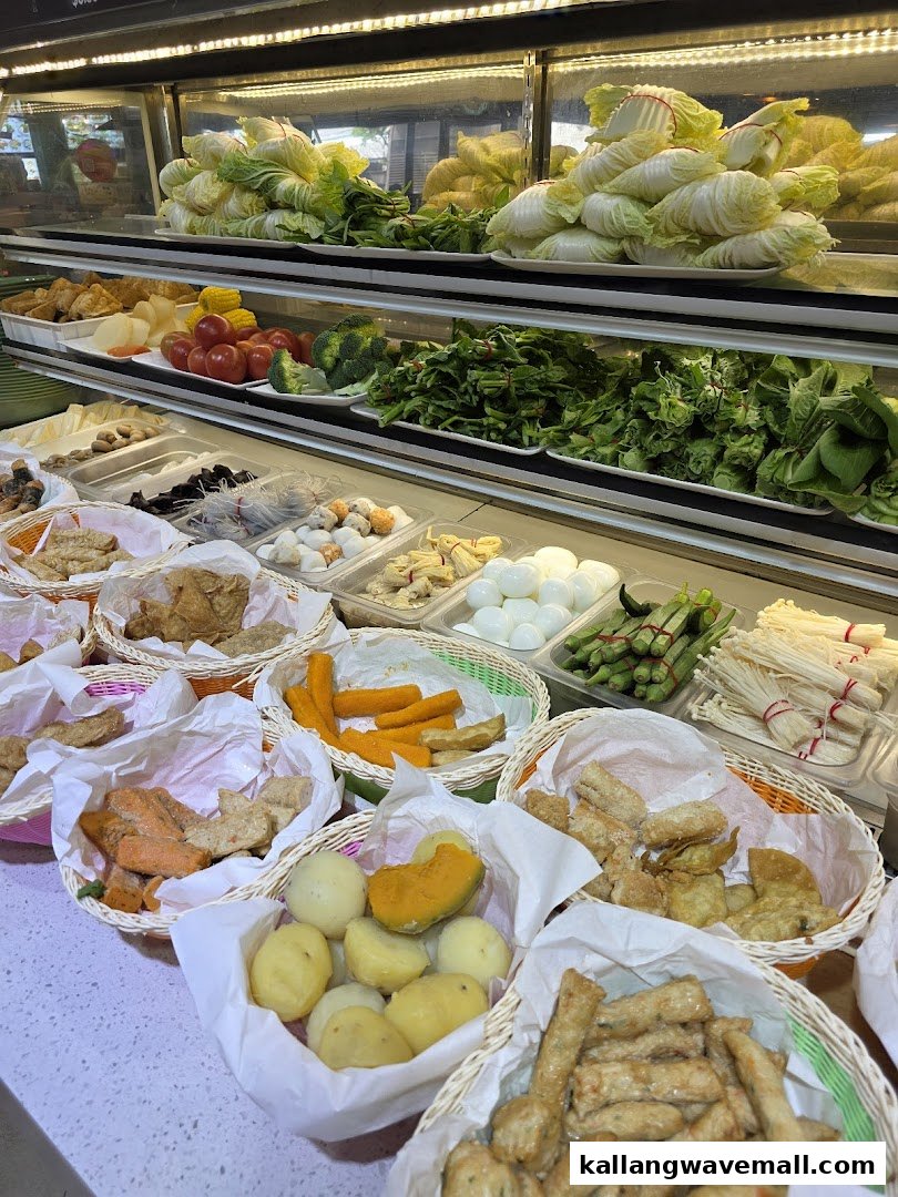 A vibrant display counter showcasing a wide variety of fresh ingredients for a customizable meal.