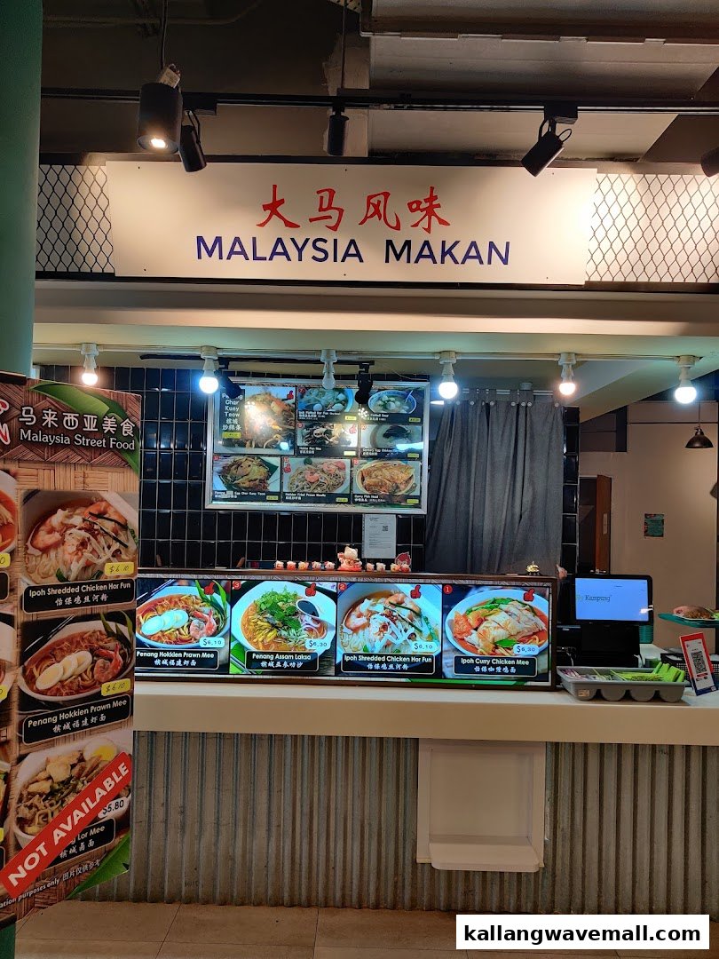 A food stall named Malaysia Makan displaying various Malaysian street food dishes and their prices.