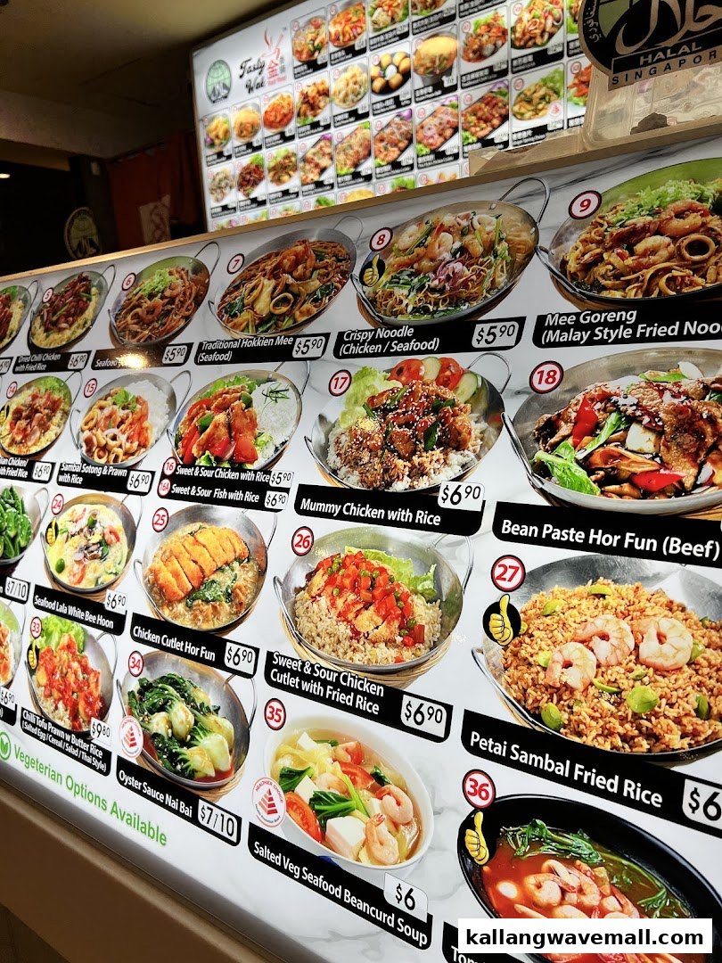 A brightly lit menu board showcasing a wide array of Asian dishes with images and prices at My Kampung.