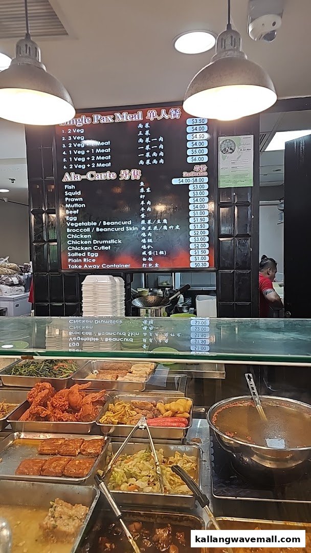 A food stall displaying a comprehensive menu board with various dishes and pricing for meals and ala-carte items.