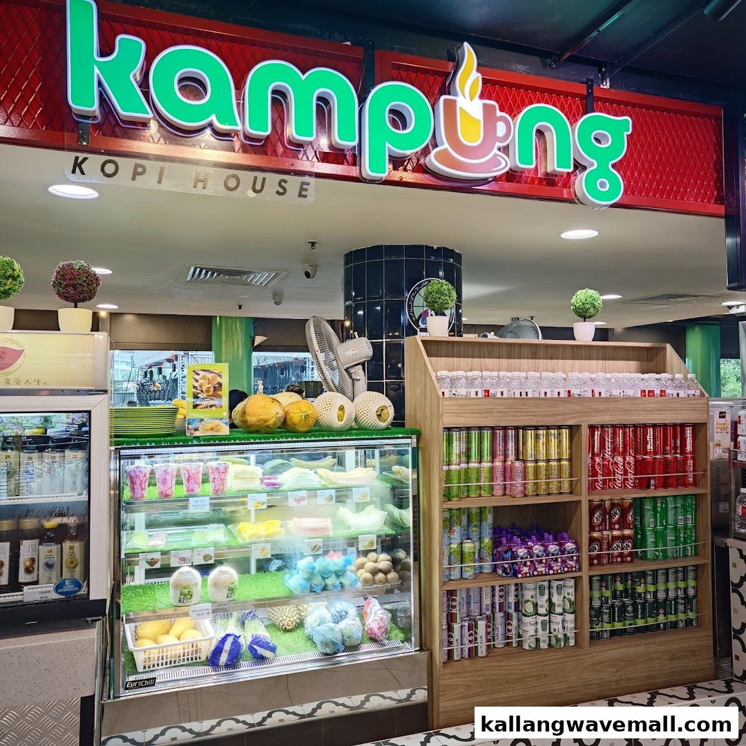 The vibrant shop front of Kampung Kopi House, featuring fresh fruits, desserts, and a variety of beverages.
