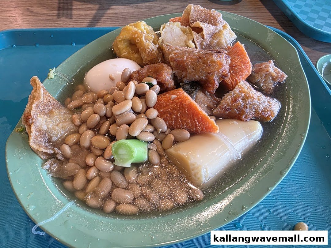 A close-up of a traditional Yong Tau Foo dish with various ingredients in a savory broth.