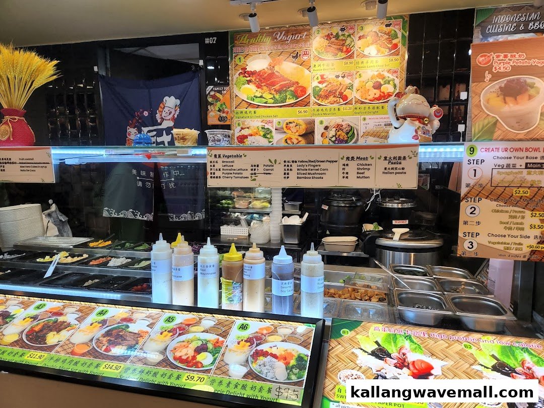 A vibrant food stall counter showcasing fresh ingredients, customizable healthy bowls, and diverse menu options.