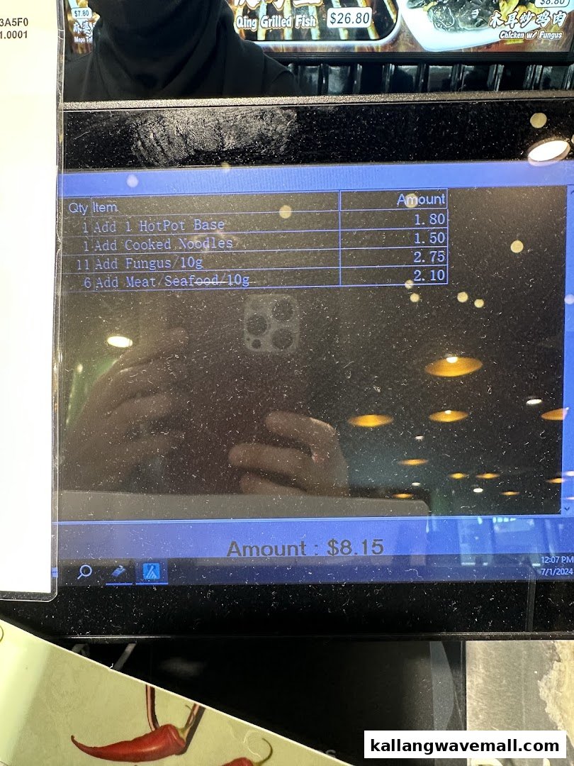 A digital screen displaying a customer's order summary with itemized food selections and prices.