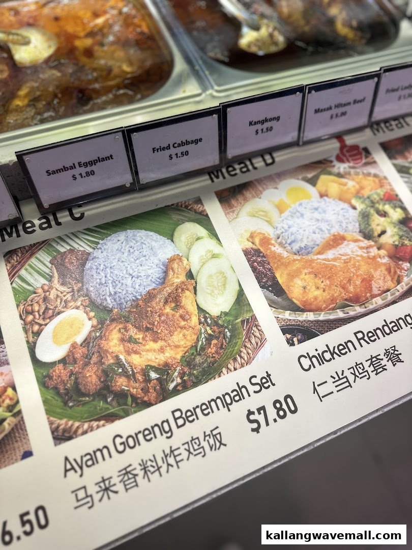 Close-up of My Kampung's menu board and food display, featuring traditional Malaysian dishes and prices.