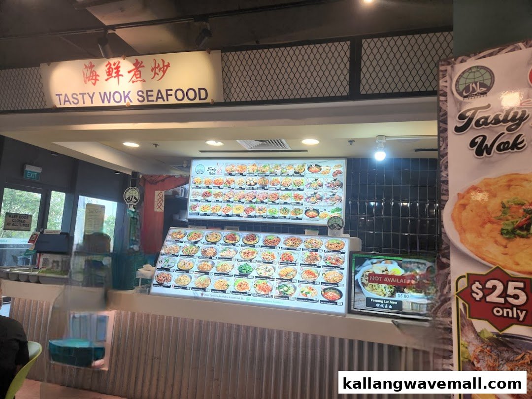 A vibrant food stall counter at Tasty Wok Seafood, showcasing a wide array of delicious Asian dishes.