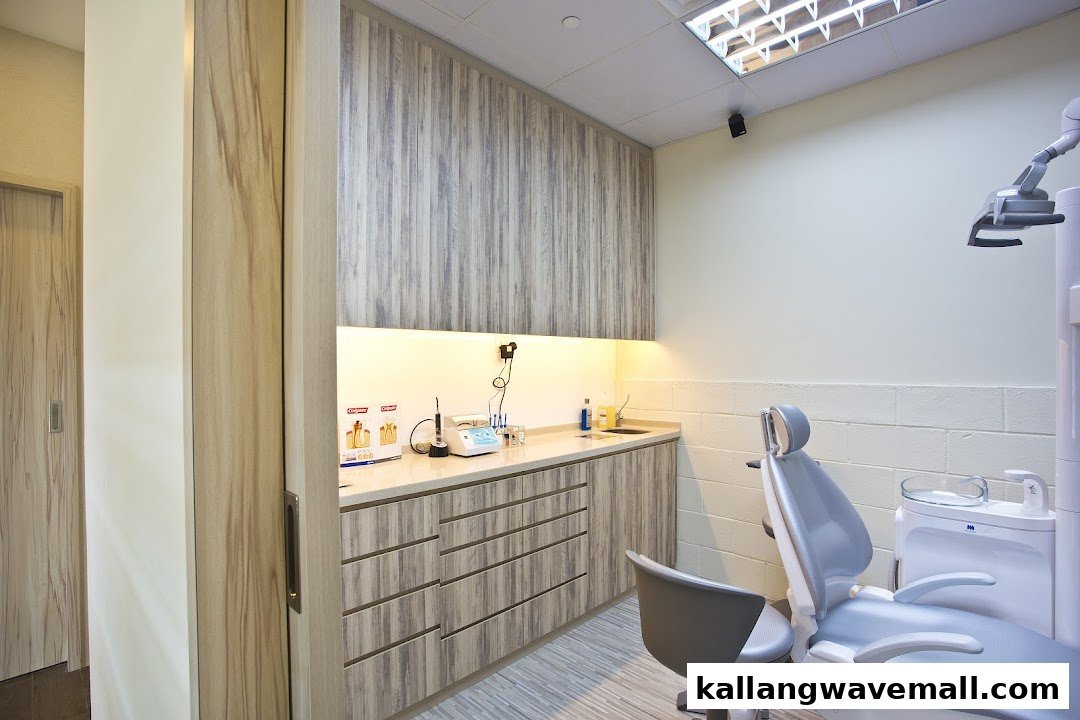 A modern and clean dental treatment room featuring a dental chair and professional equipment.
