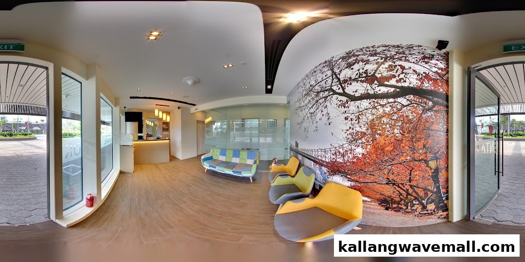 A modern and welcoming dental clinic interior featuring a reception desk, comfortable seating, and a scenic wall mural.