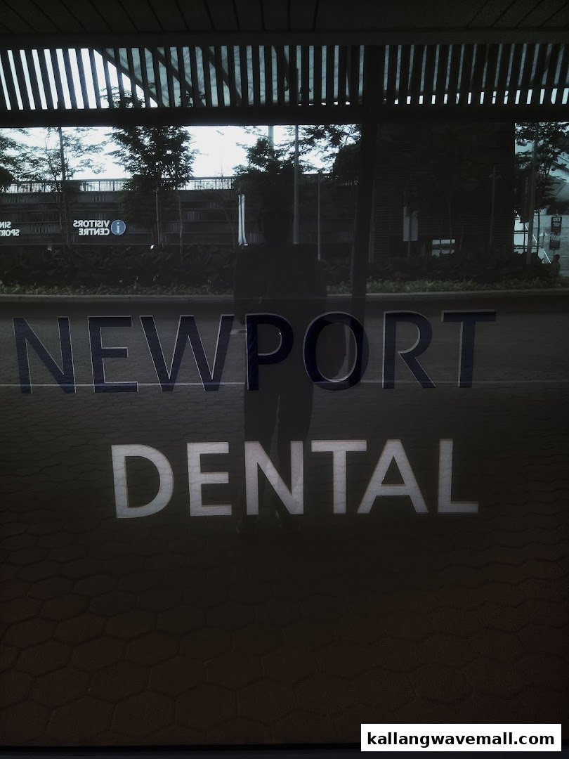 The shop front of Newport Dental, with its name prominently displayed on the glass entrance.