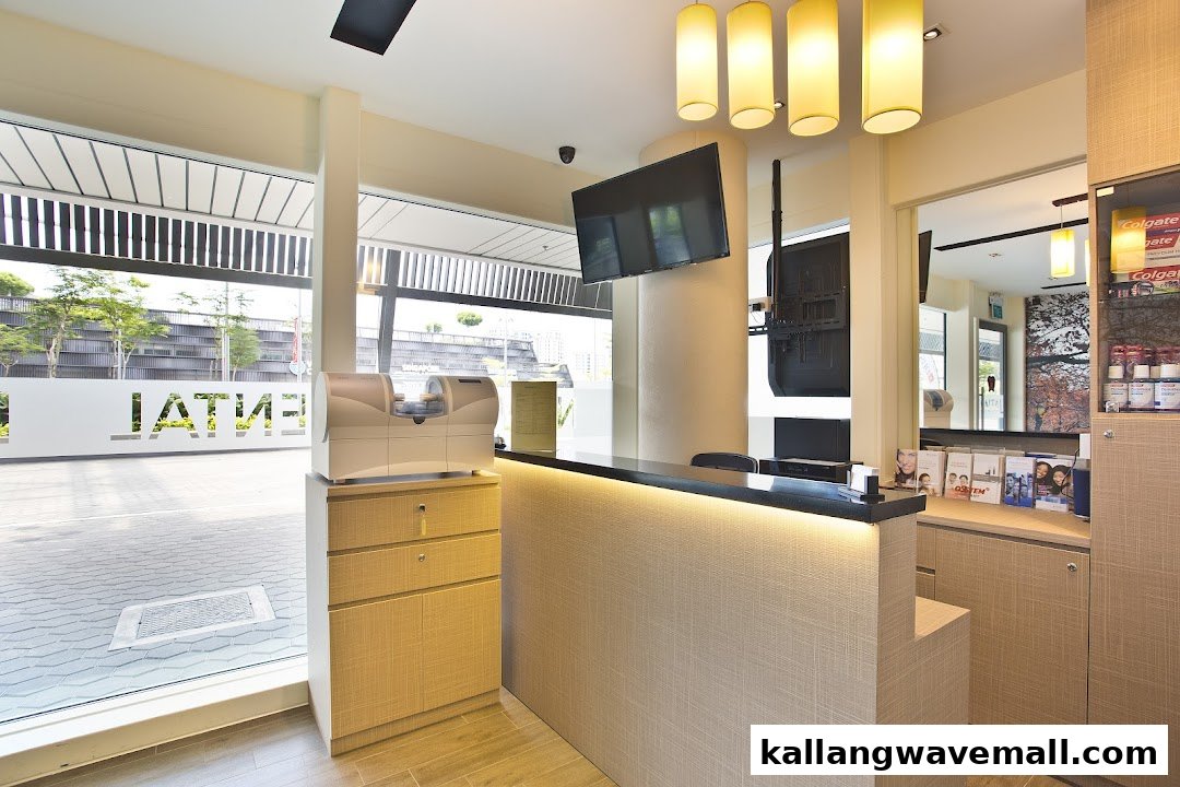 A bright, modern reception area of Newport Dental clinic with a front desk and large windows.
