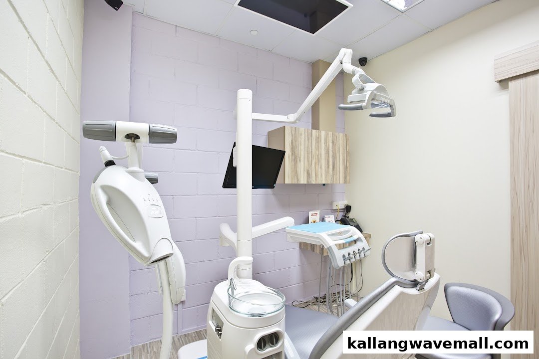 A clean, modern dental treatment room with a patient chair and advanced equipment.