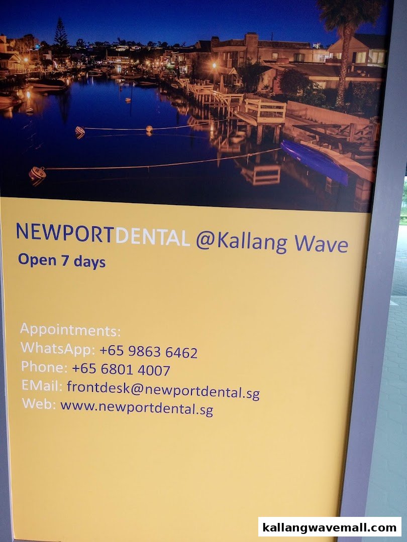 A sign for Newport Dental @ Kallang Wave, displaying contact information and operating hours.