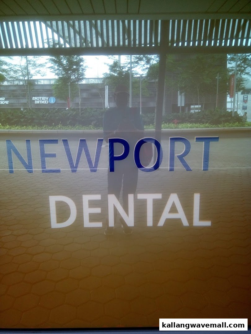 The Newport Dental sign is prominently displayed on the shop's glass entrance.