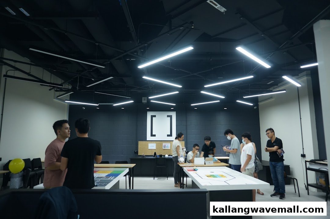 People engaged in robotics activities and learning in a modern, well-lit workshop at Nullspace Robotics.