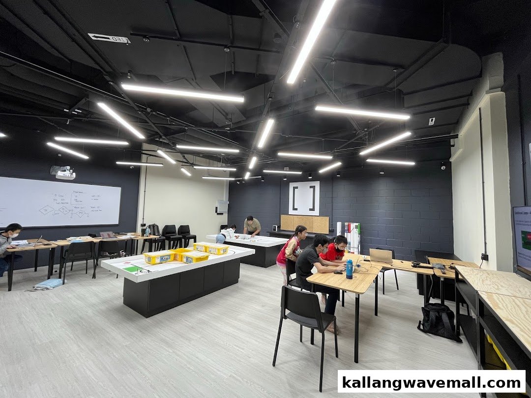 Students and instructors engaged in hands-on robotics activities within a modern classroom at Nullspace Robotics.