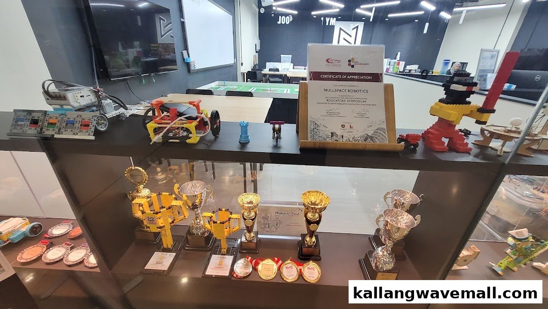 An interior view of Nullspace Robotics showcasing student projects, awards, and a learning space.