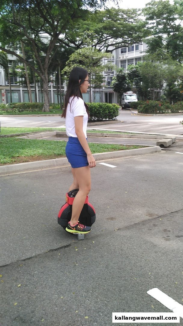 A person rides an electric unicycle outdoors, showcasing the fun activity offered by O-Ride Singapore.