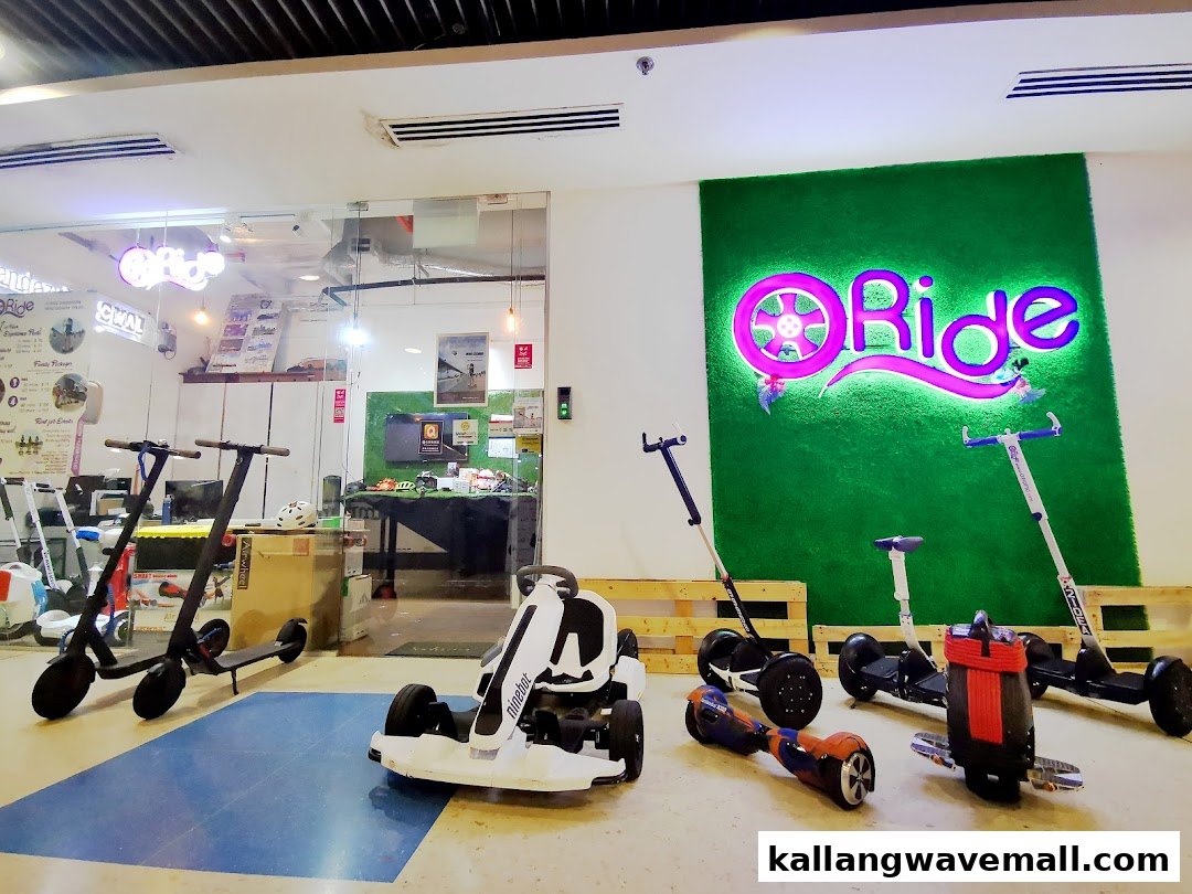 An interior view of O-Ride Singapore Mini Segway Tours, showcasing various personal mobility devices like segways, scooters, and go-karts.