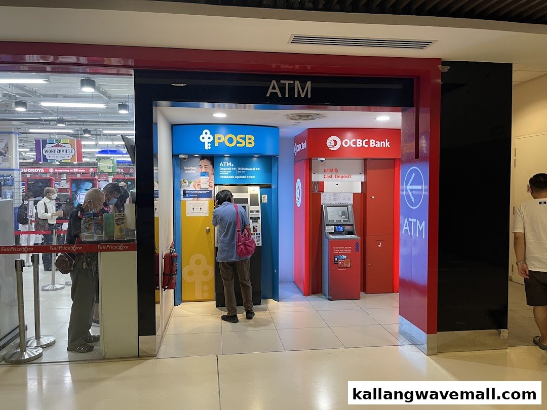 Two bank ATMs, OCBC and POSB, are available for cash and banking services in a mall.