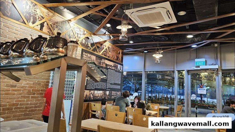 Interior view of Old Street Bak Kut Teh, featuring customers, wooden tables, and traditional decor.