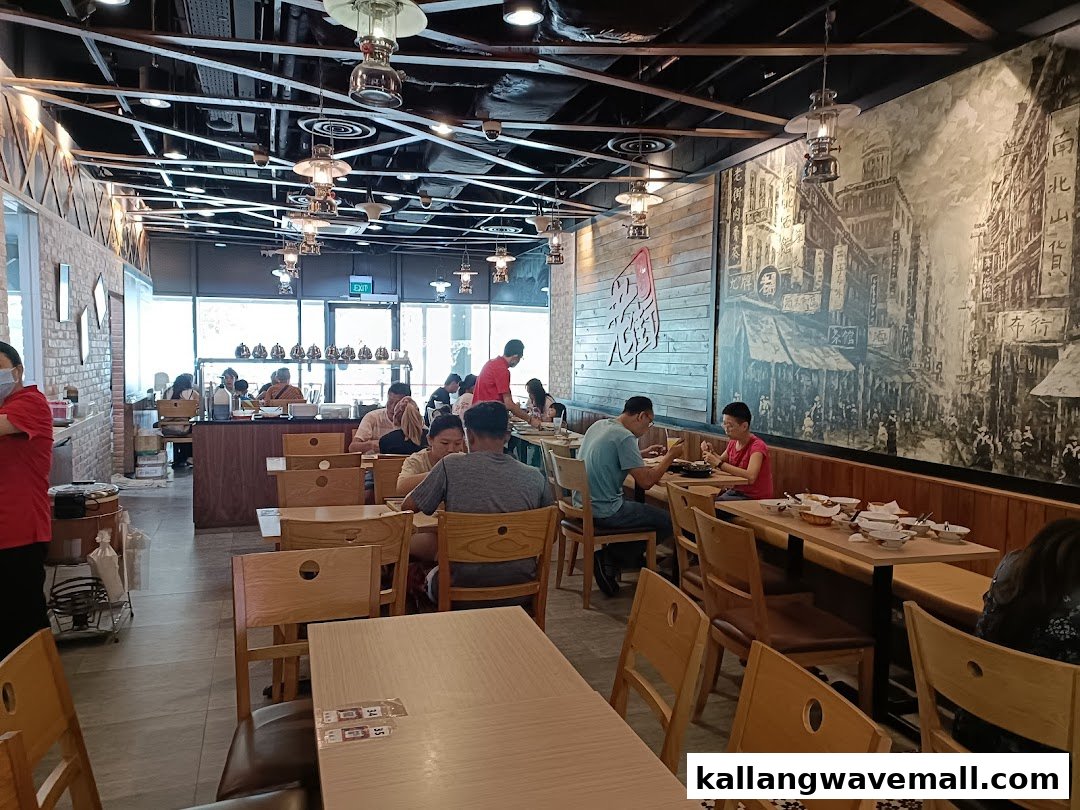 Interior view of Old Street Bak Kut Teh restaurant with customers dining in a spacious setting.