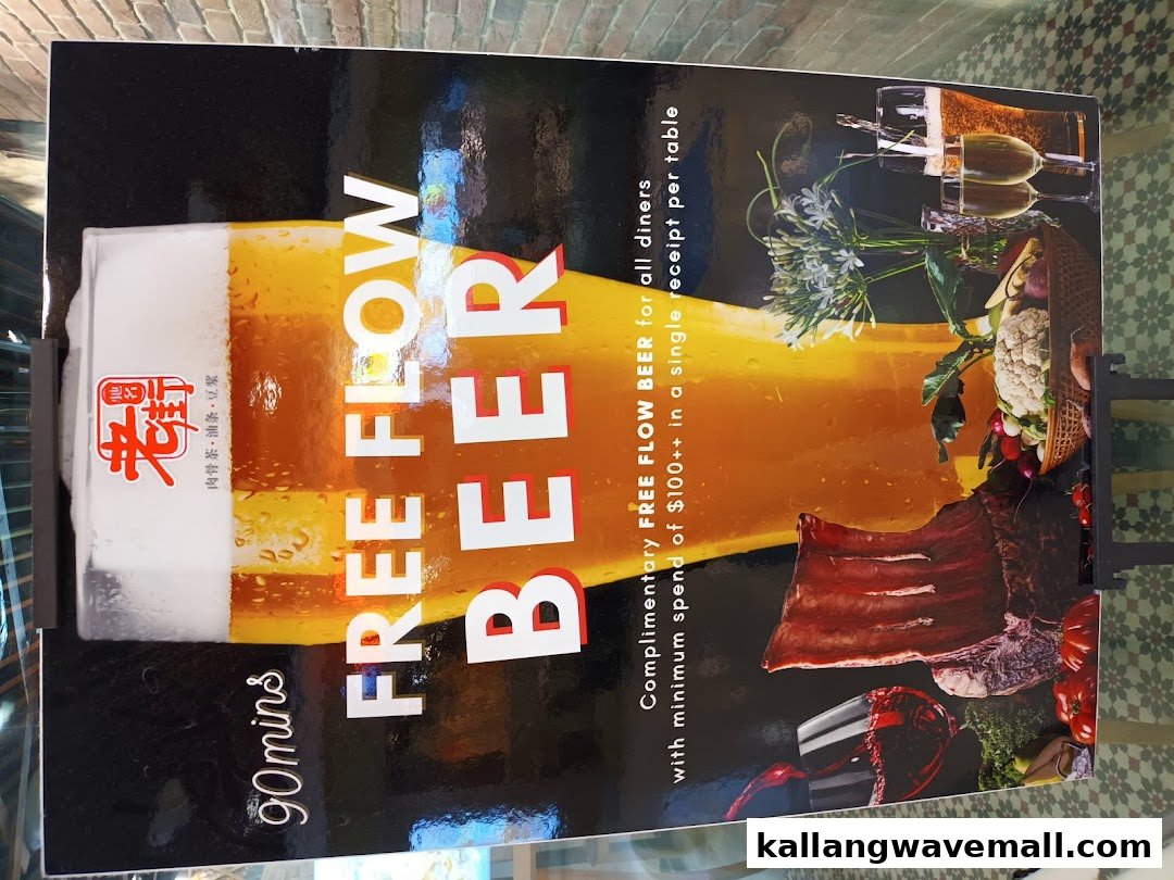 A promotional sign for Old Street Bak Kut Teh offering complimentary free-flow beer with a minimum spend.