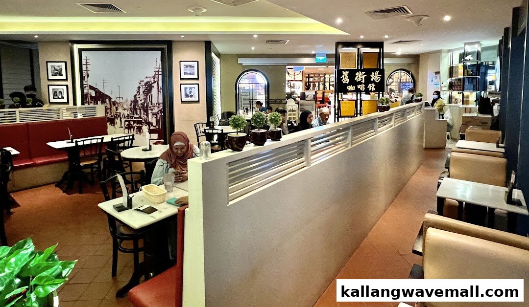 Interior view of Oldtown White Coffee with customers dining in a cozy, traditional setting.