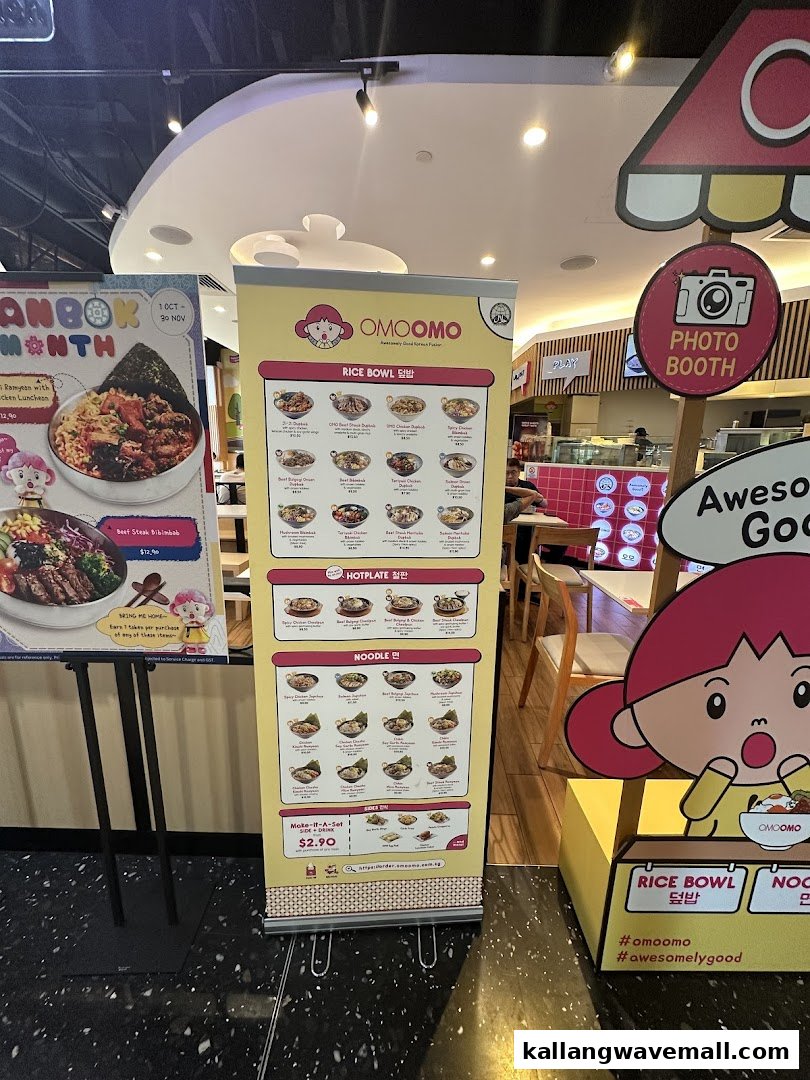 A vibrant menu display stand showcasing OMOOMO's Korean rice bowls, hotplates, and noodles.
