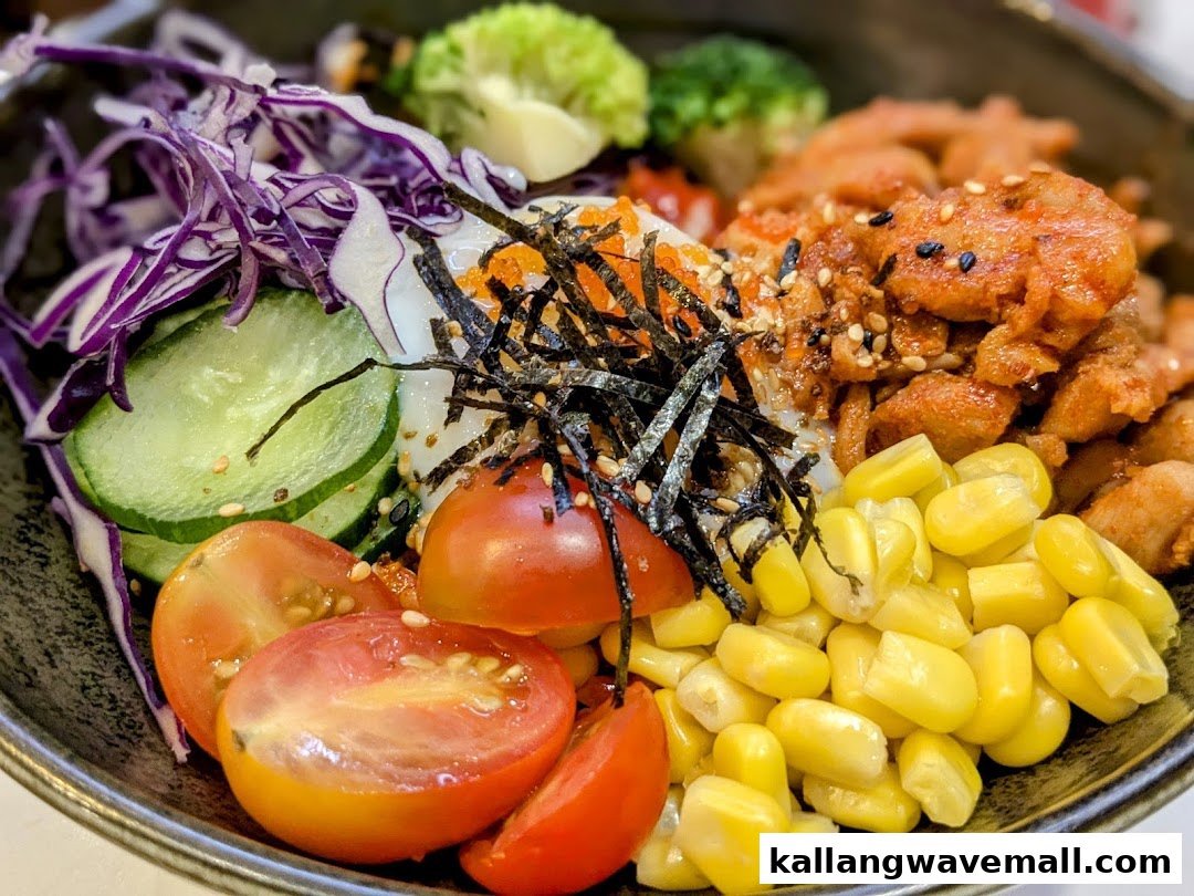 A vibrant, colorful food bowl featuring various fresh ingredients like vegetables, corn, and protein.