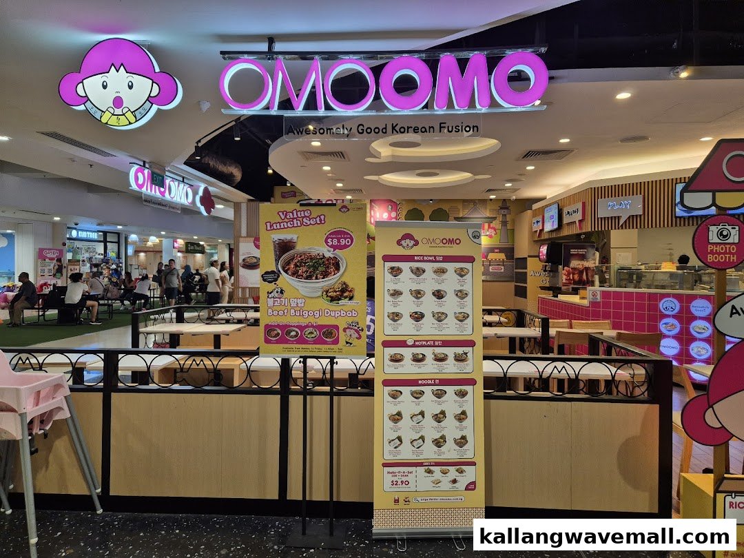 The vibrant OMOOMO Korean fusion restaurant entrance with bright signage and menu displays.