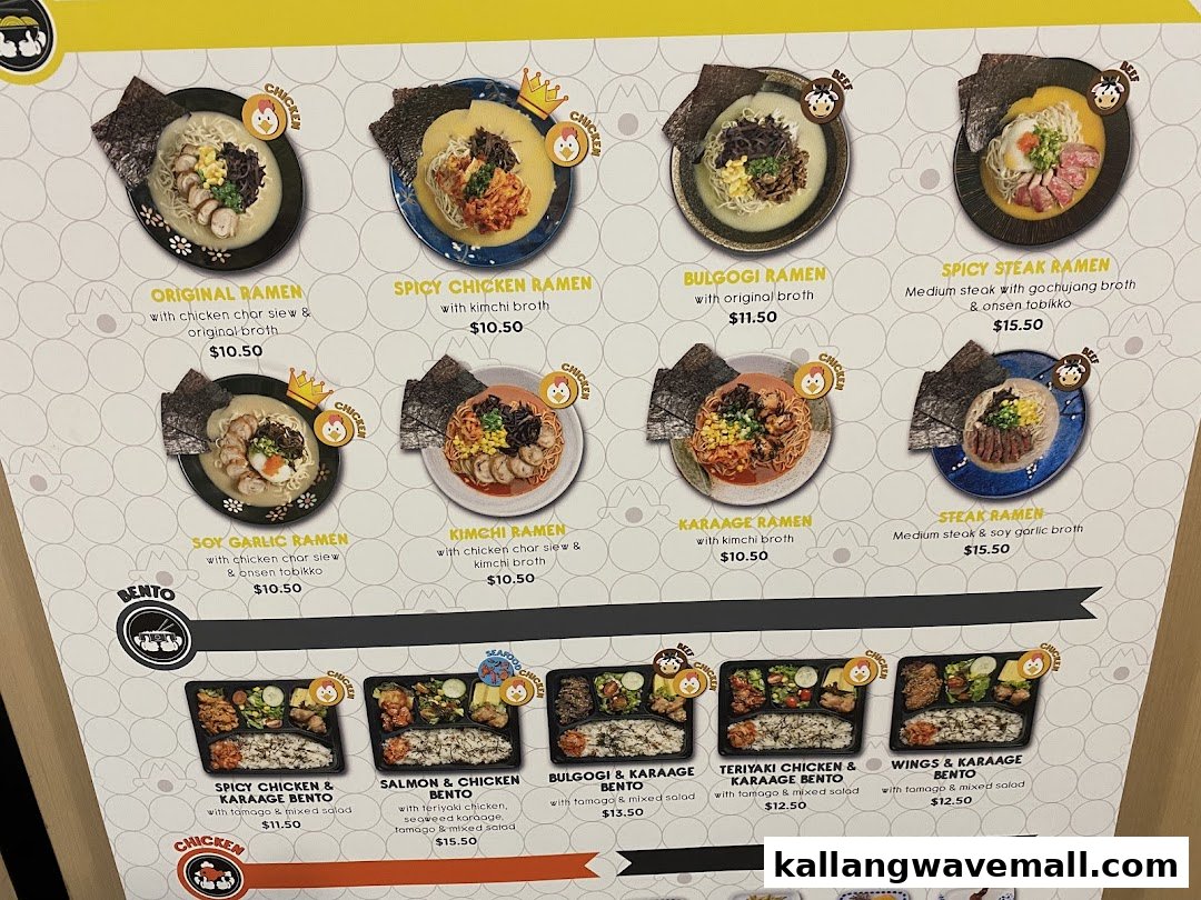 A detailed menu board displaying various ramen and bento options with prices and images.