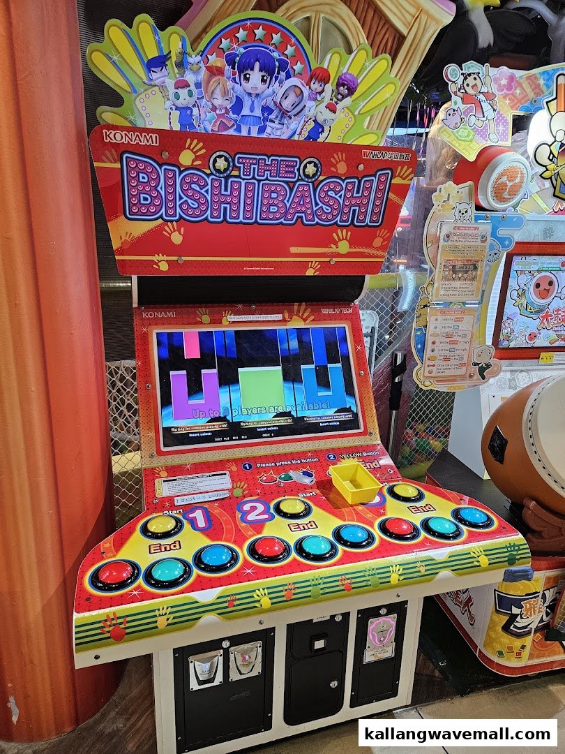 An arcade game machine, 'The BishiBashi', with colorful buttons and a screen.
