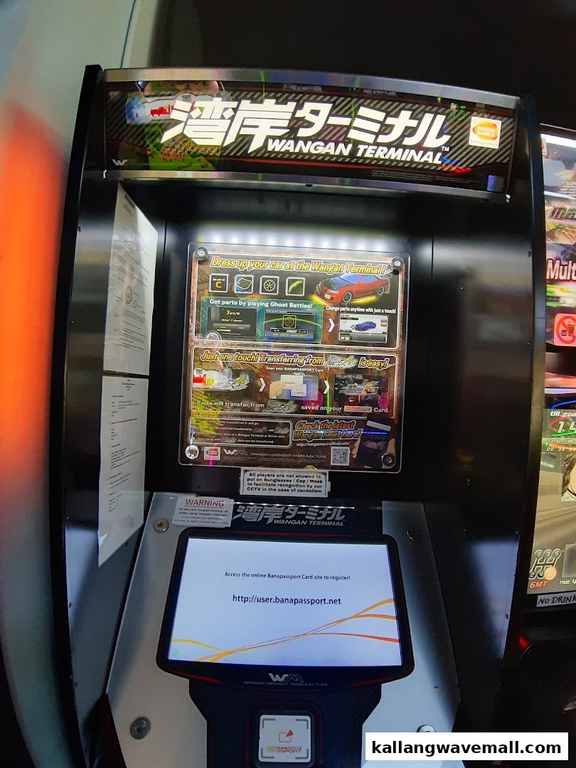 A Wangan Terminal arcade game machine, part of Paco FunWorld, for interactive racing experiences.