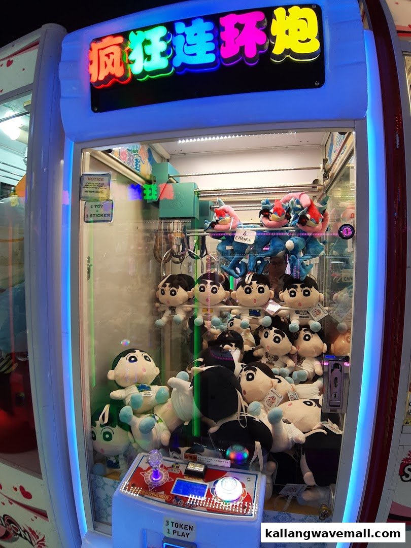 A brightly lit claw machine filled with various plush toys, ready for players to win prizes.
