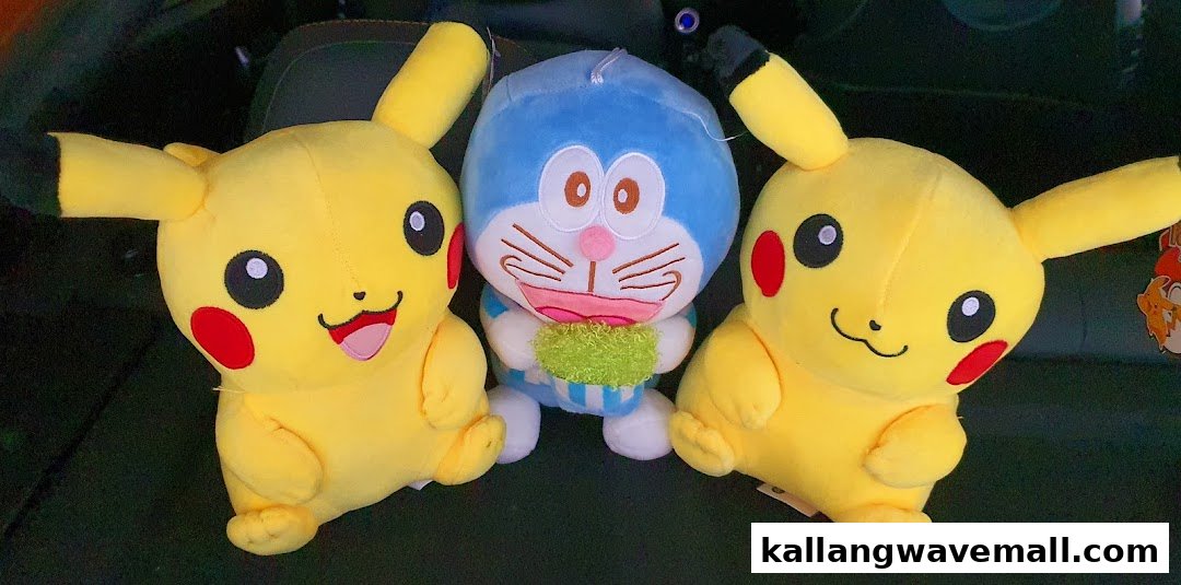 Three popular character plush toys, including two Pikachu and one Doraemon, displayed together.