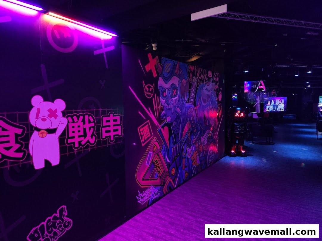 A vibrant, neon-lit interior of an entertainment venue featuring colorful graffiti art and futuristic decor.