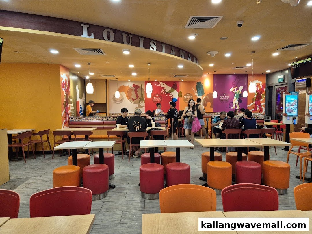 Vibrant interior of Popeyes with customers dining at tables and booths.