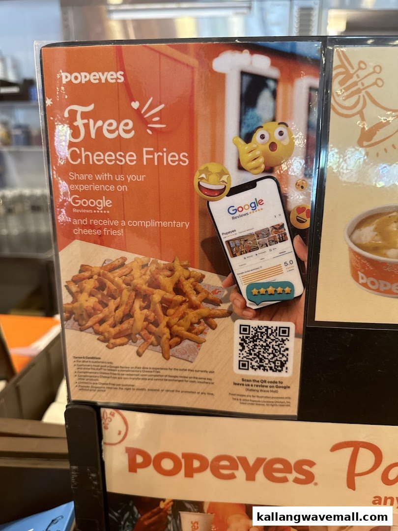 A Popeyes promotional sign offering free cheese fries for Google reviews.