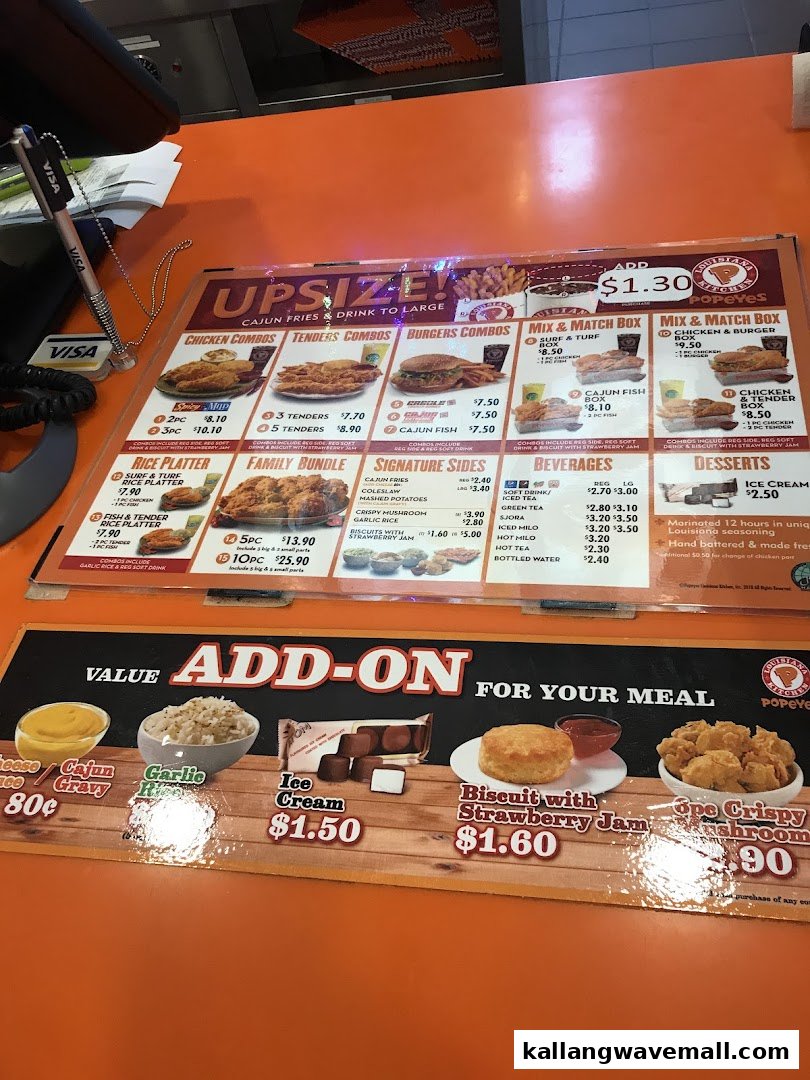 A detailed Popeyes menu board displaying various chicken, combo, and add-on options with prices.