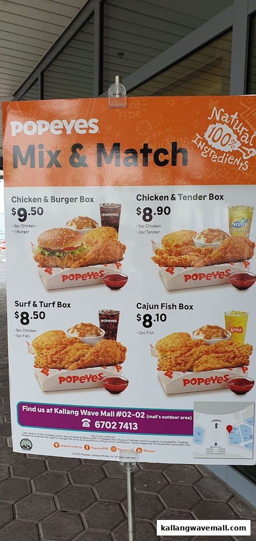A Popeyes menu board showcasing 'Mix & Match' meal boxes with prices and contact information.
