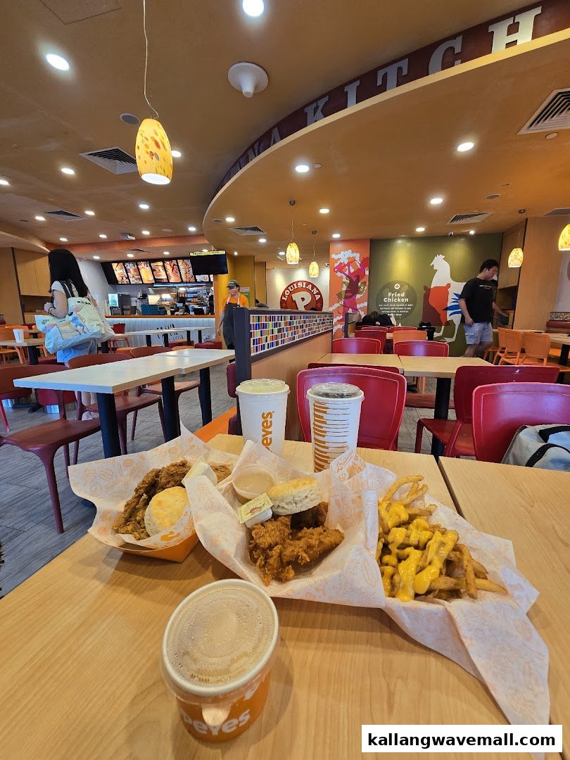 A vibrant interior shot of Popeyes with customers enjoying fried chicken meals.