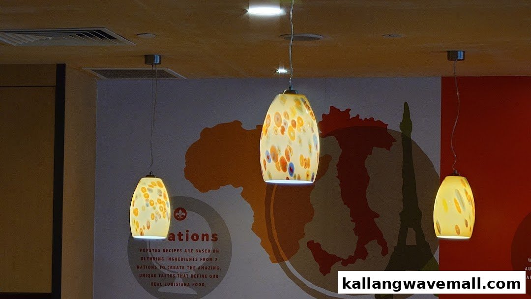 Interior view of Popeyes featuring decorative pendant lights and a wall mural.