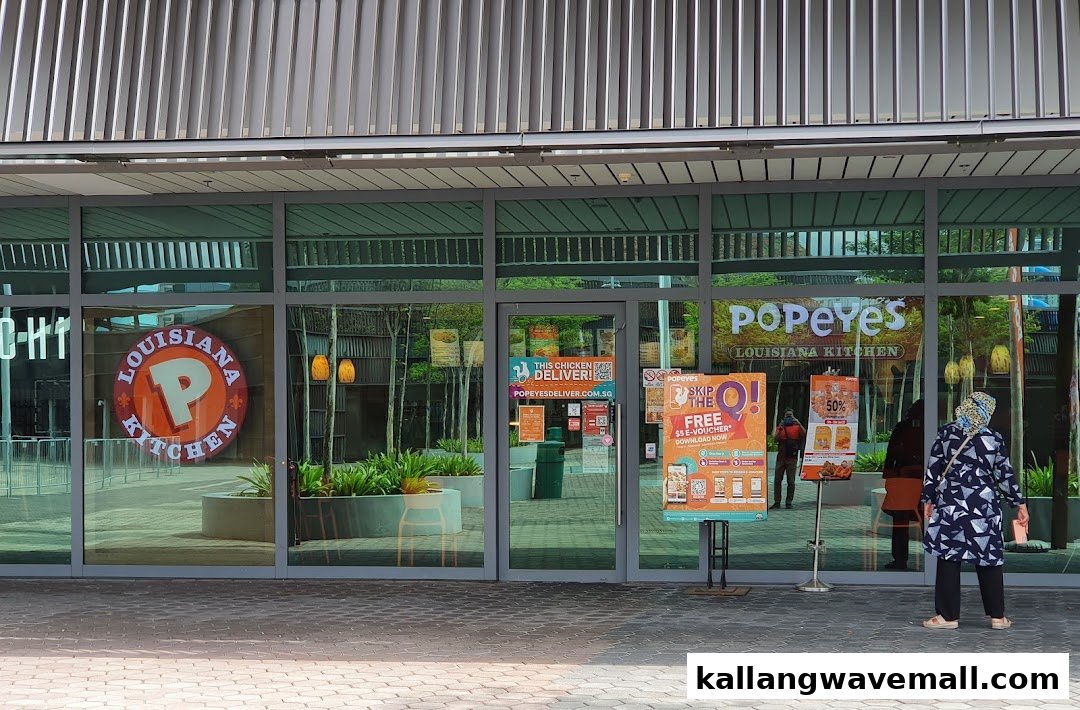 Exterior view of Popeyes Louisiana Kitchen at Kallang Wave Mall, featuring its entrance and signage.