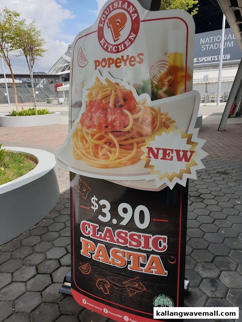 A Popeyes standee advertising their new Classic Pasta for $3.90.
