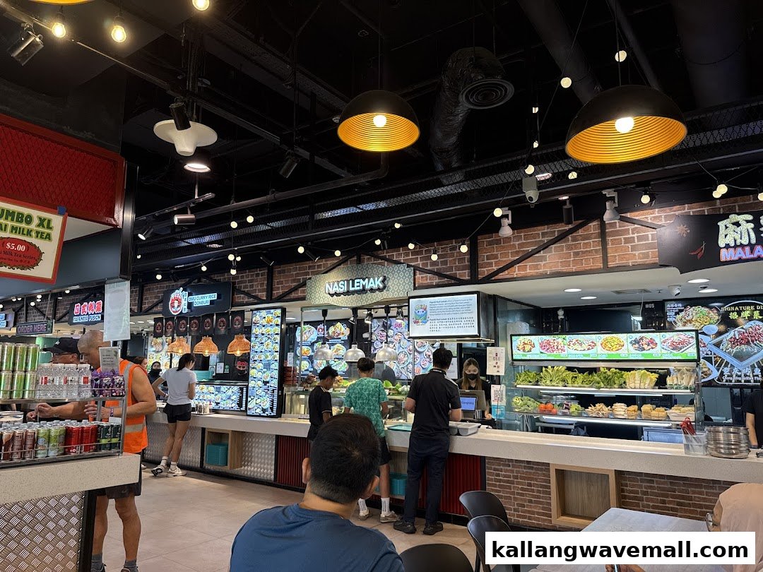 A bustling food stall specializing in Nasi Lemak within a vibrant food court setting.