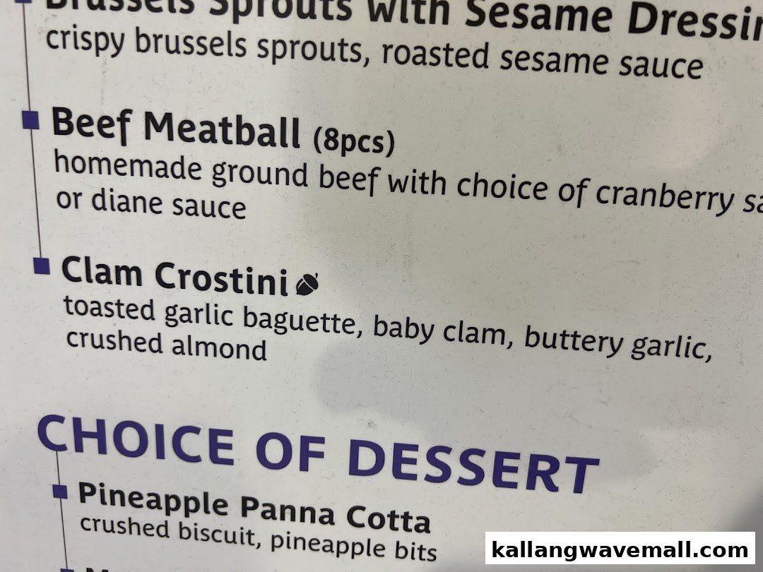 A close-up of a restaurant menu displaying appetizer and dessert options.