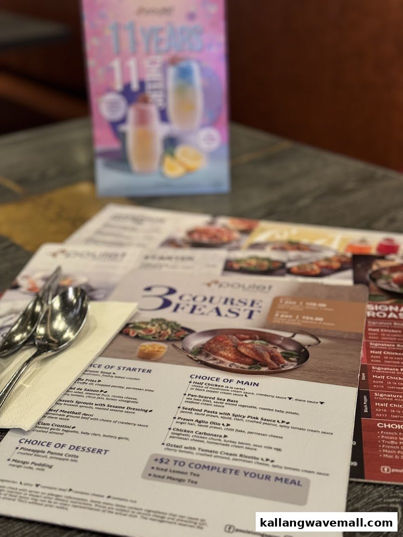 A close-up of Poulet's 3-course feast menu, showcasing various French-inspired dishes and drink options.