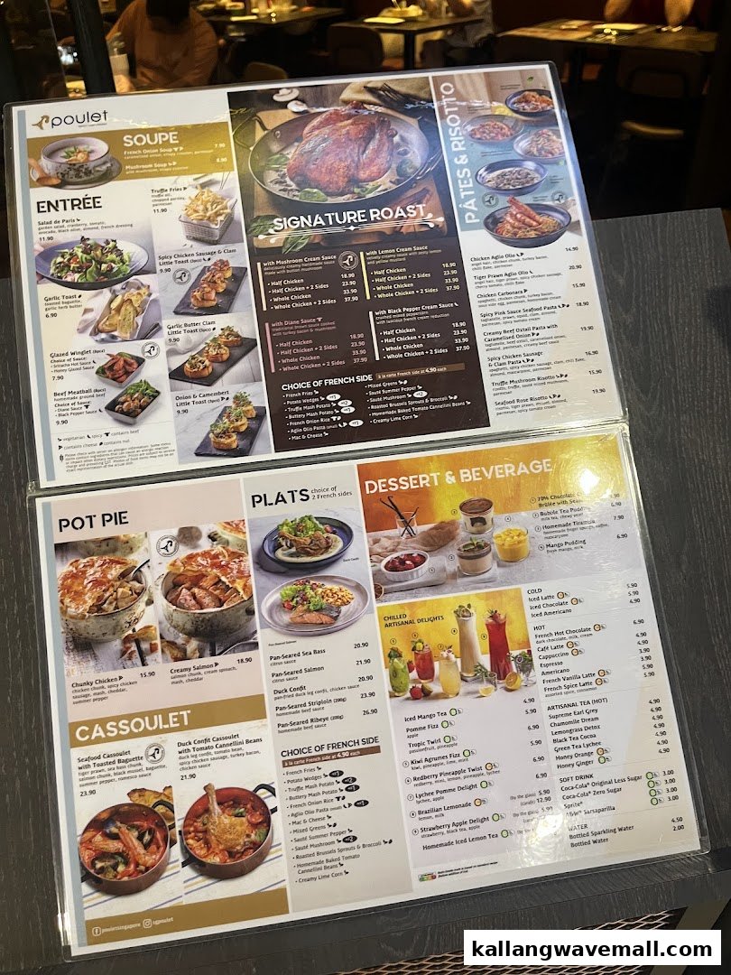 A close-up view of Poulet's laminated menu, showcasing a variety of French-inspired dishes and beverages.