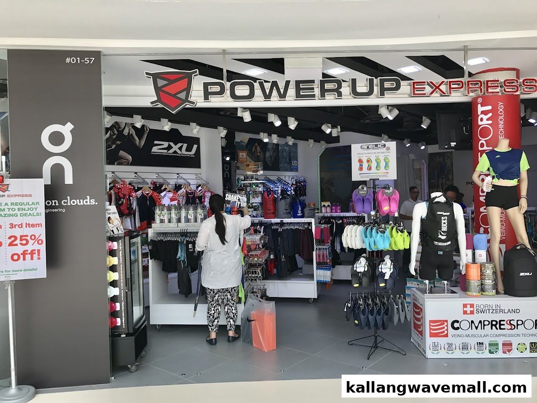 The storefront of Power Up Express, a sports and activewear shop, displaying apparel and accessories.