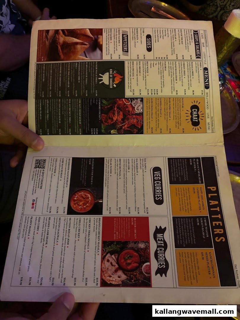 A detailed menu displaying a wide variety of Indian dishes, including appetizers, curries, and platters.